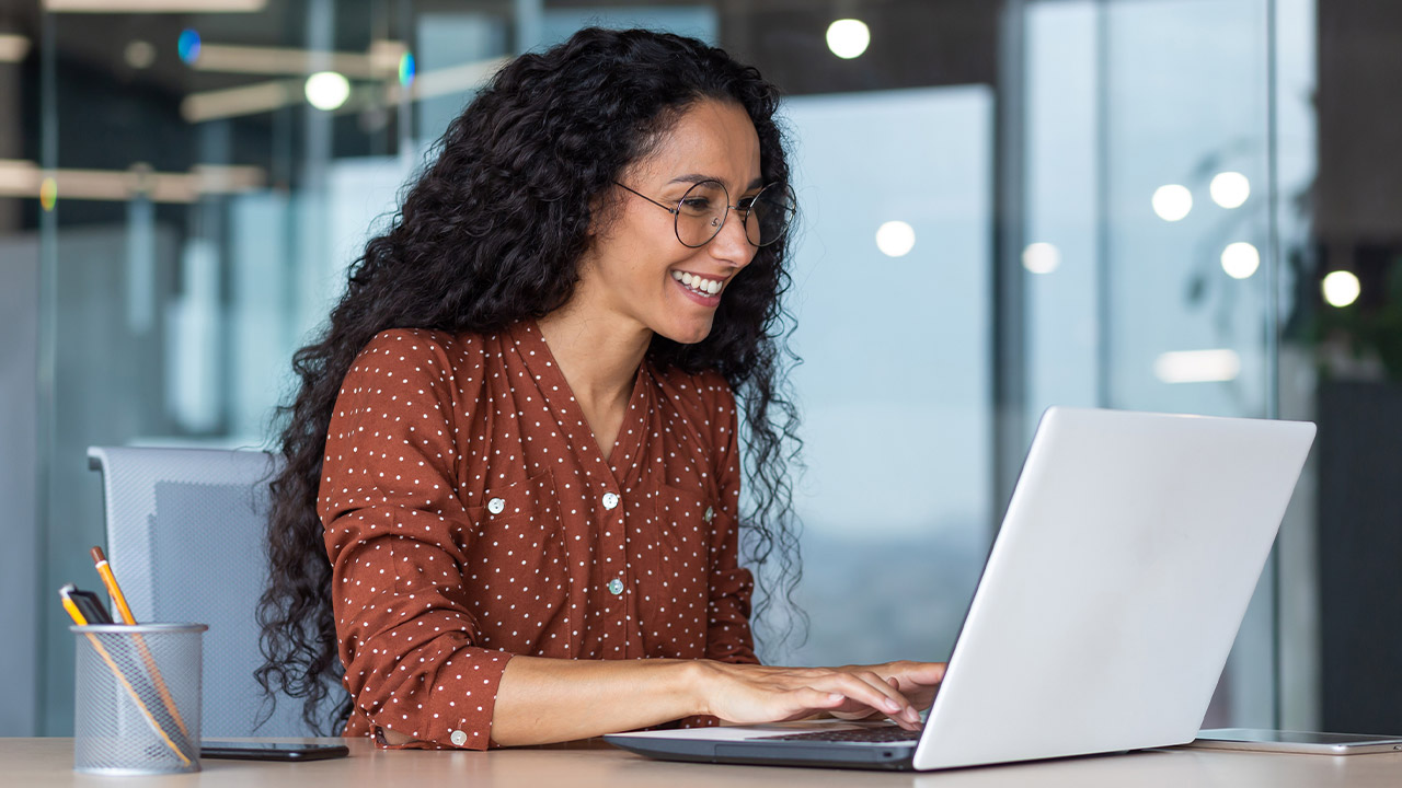 Woman In Red At Computer